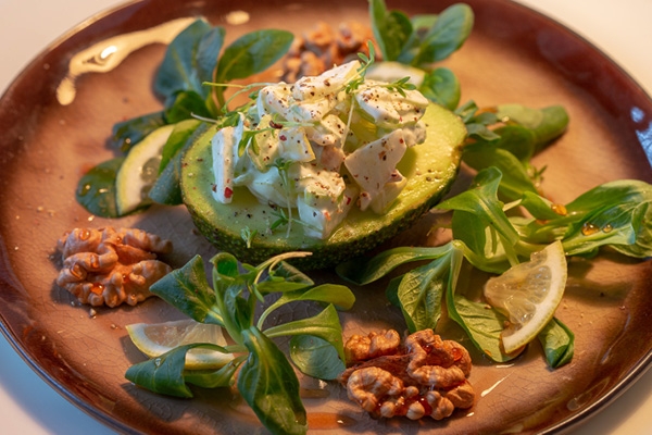 Avocado with green celery, apple and walnut filling